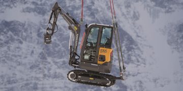 Electrical excavator airlifted to Alpine summit for difficult lodge process