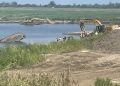 Employee dies when excavator falls into water