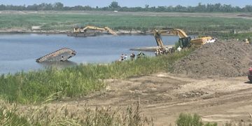 Employee dies when excavator falls into water