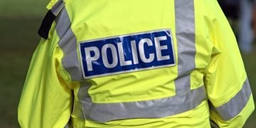 Automobile hits building pickets