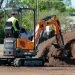 Develon Mini Excavator’s Retractable Undercarriage and Collapsible Dozer Blade Make It Slender