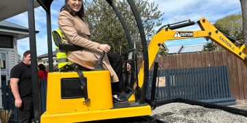 Minister digs in for mini excavator journey