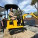 Minister digs in for mini excavator journey