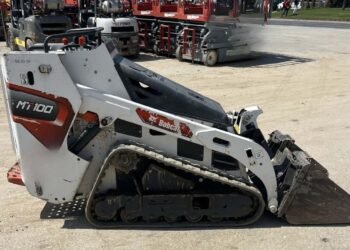 Guy charged in robbery of still-missing excavator