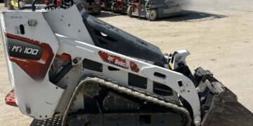 Guy charged in robbery of still-missing excavator